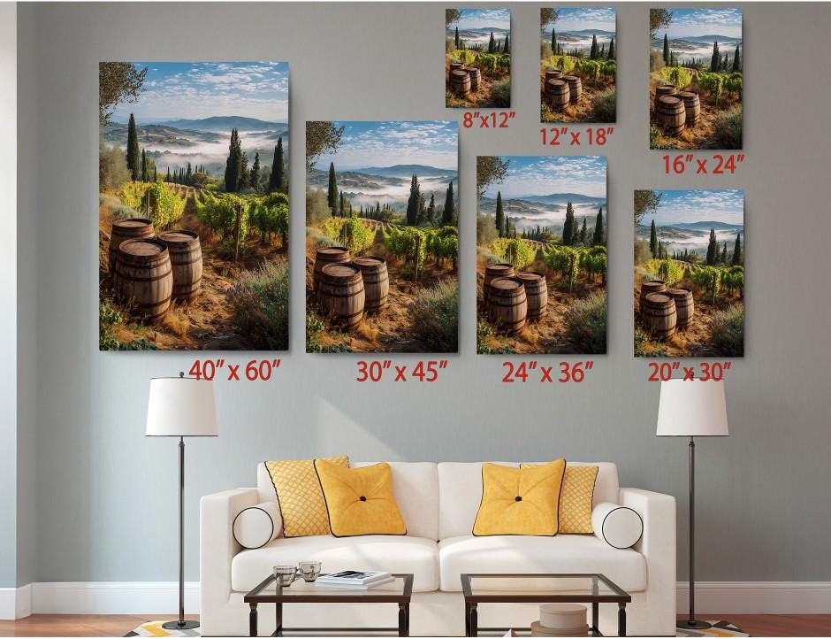 The image is a living room with a white sofa and a coffee table. Above the sofa, there are six framed pictures of vineyards, each with a different size and resolution, ranging from 8x12 to 24x36 inches. The pictures are arranged in a grid-like pattern on the wall, creating a visually appealing display.