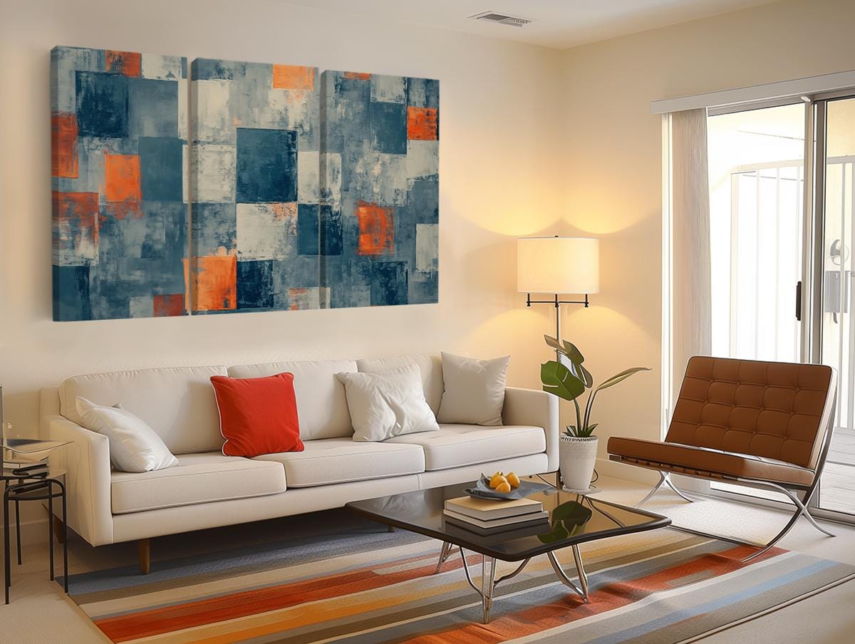 a living room filled with furniture and a painting on the wall