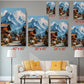 The image is a living room with a white sofa and a coffee table. Above the sofa, there are six framed pictures of mountain landscapes, each with a different size and resolution. The pictures are arranged in a grid-like pattern on the wall, with each one depicting a different view of the mountains.
