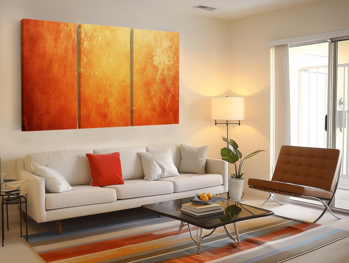 a living room with a white couch and a painting on the wall