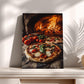 A framed photograph of a pizza with fresh basil and tomatoes, placed on a wooden surface, with a brick oven visible in the background.