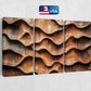 three panels of wood with wavy shapes on a wall