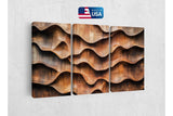 three panels of wood with wavy shapes on a wall