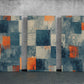 three abstract paintings on a concrete wall