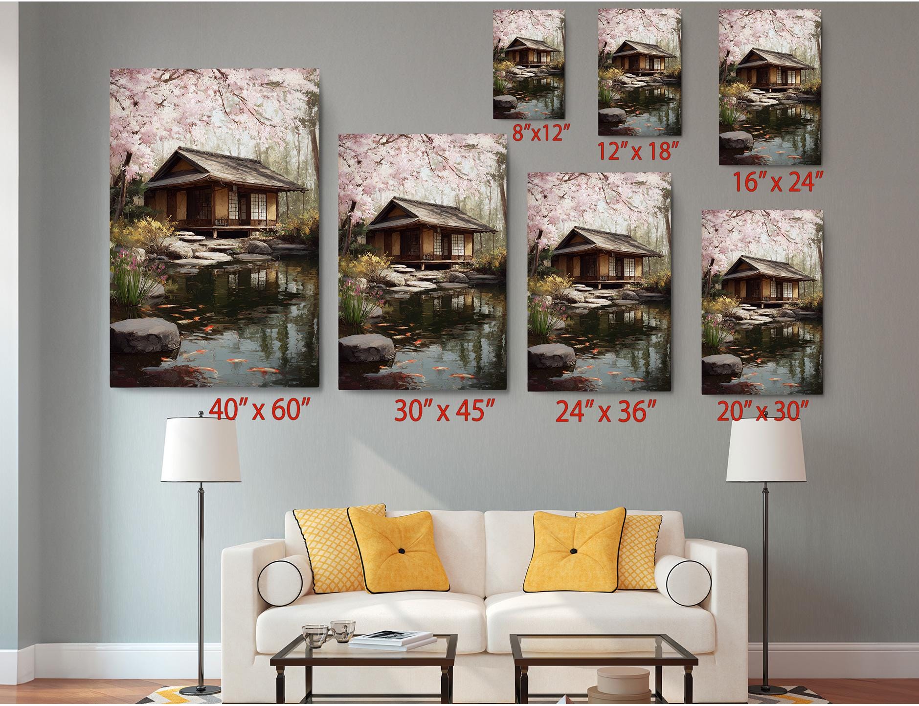 The image is a living room with a white sofa and a coffee table, and there are several framed pictures of a house and a garden displayed on the wall above the sofa.