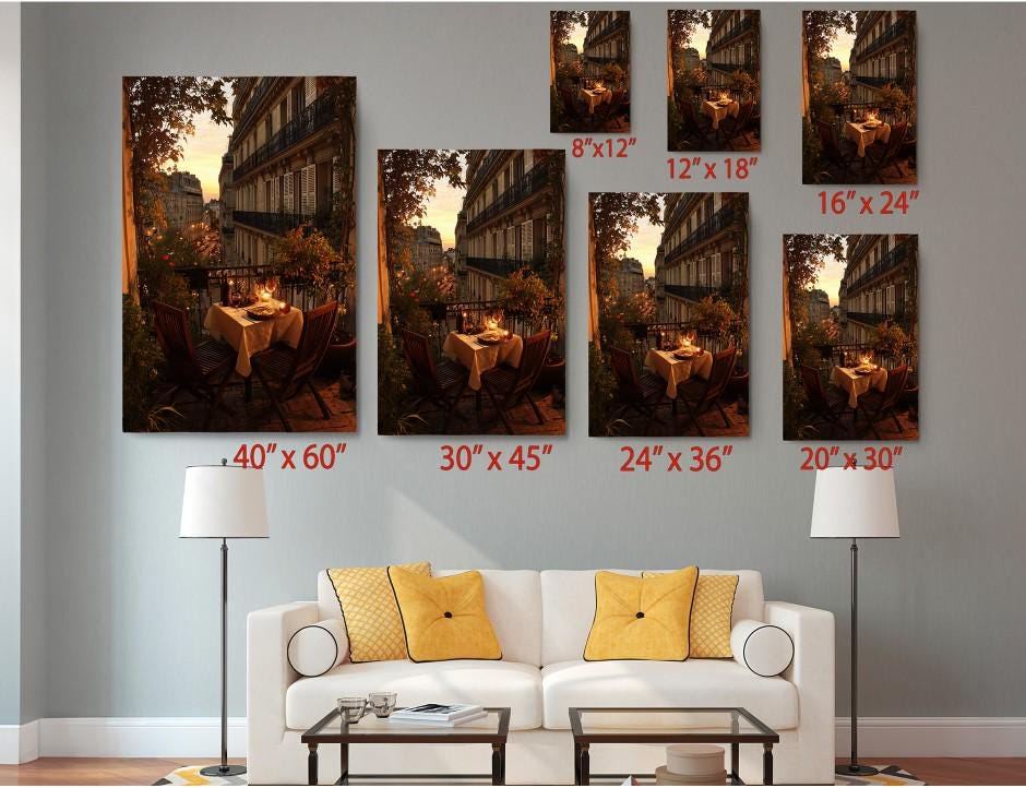 The image is a living room with a white sofa and a coffee table. Above the sofa, there are seven framed pictures of the same scene, each with a different size and orientation. The pictures are arranged in a grid-like pattern, with the largest one at the top and the smallest at the bottom. The sizes of the pictures are labeled with the corresponding measurements: 40 x 60, 30 x 45, 24 x 36, 20 x 30, and 20 x 24.
