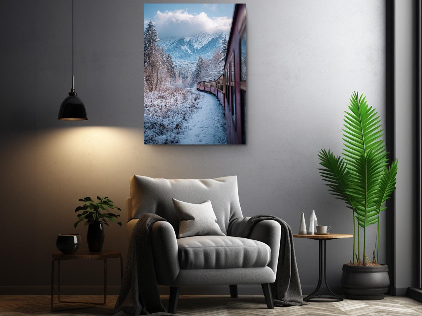 a cozy living room with a comfortable gray armchair, a small side table, and a potted plant. Above the armchair, there is a framed photograph of a snowy mountain landscape with a train passing through the snowy scenery.