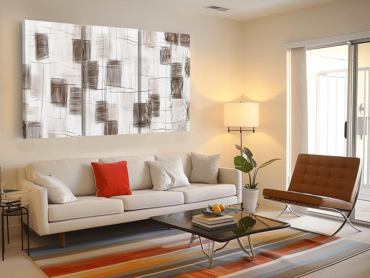 a living room filled with furniture and a painting on the wall