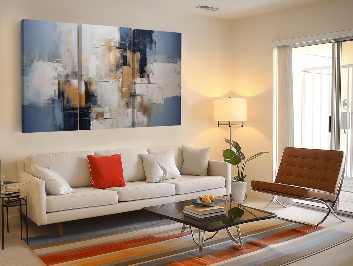 a living room filled with furniture and a painting on the wall