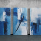 three paintings of blue and white on a wall