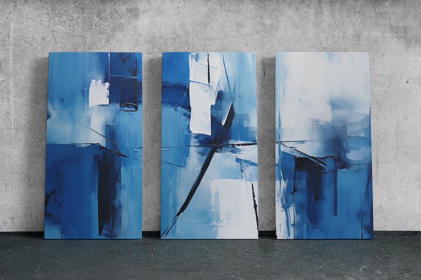 three paintings of blue and white on a wall