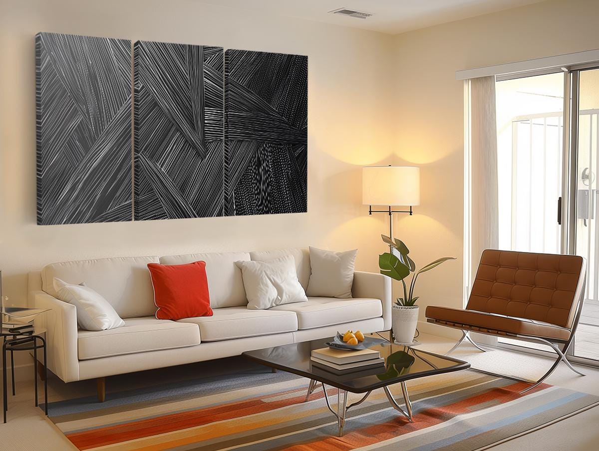 a living room filled with furniture and a painting on the wall