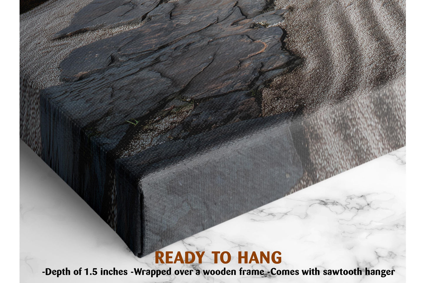 The image is a close-up of a textured surface, possibly a wooden frame or a marble countertop, with a text overlay that reads &quot;READY TO HANG&quot; and provides dimensions, stating &quot;Depth of 1.5 inches - Wrapped over a wooden frame - Comes with sawtooth hanger&quot;.