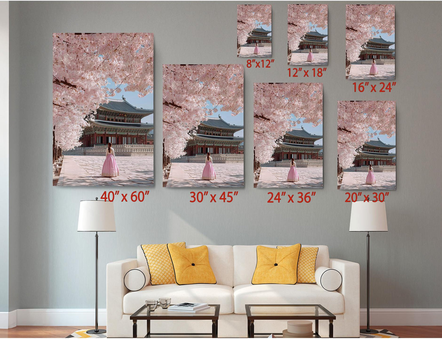 The image is a living room with a white sofa and a coffee table. Above the sofa, there are six framed pictures of a woman in a pink dress, each with a different size and orientation, ranging from 8&quot; x 12&quot; to 24&quot; x 36&quot;. The pictures are arranged in a grid-like pattern on the wall, creating a visually appealing display.
