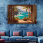 a large painting of a tropical beach scene hanging on a blue wall above a blue couch with pink pillows.