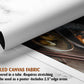 The image is a rolled canvas fabric, which is a type of canvas material used for creating posters or wall art. It is described as a tube-delivered fabric, which means it is delivered in a tube and requires stretching before use. The fabric can be used as a poster and includes a 2.5&quot; edge area.