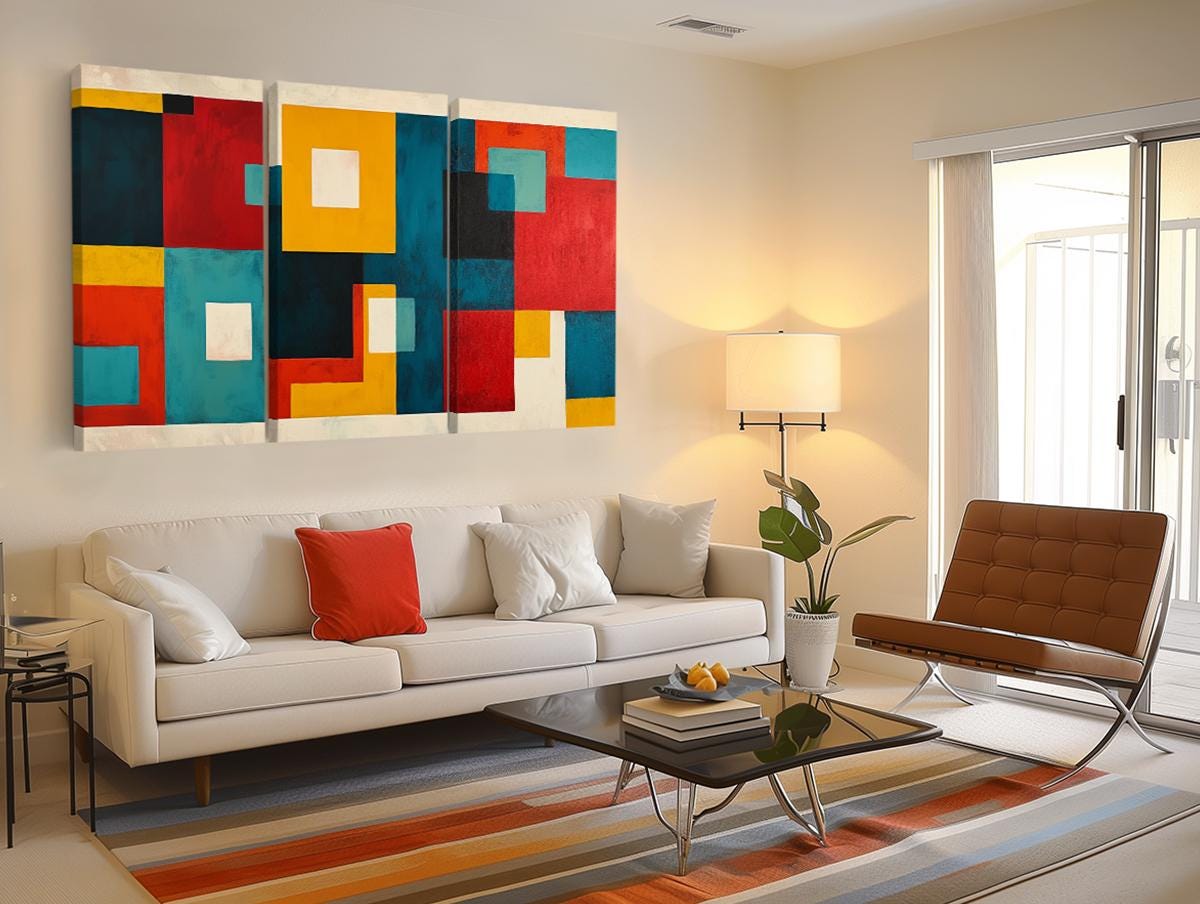 a living room filled with furniture and a painting on the wall