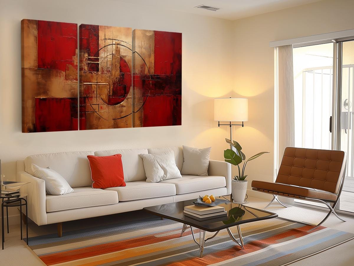 a living room with a white couch and a painting on the wall