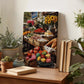 a wooden table with a painting of a fruit and vegetable market displayed on it. The table also has several potted plants, books, and other decorative items.
