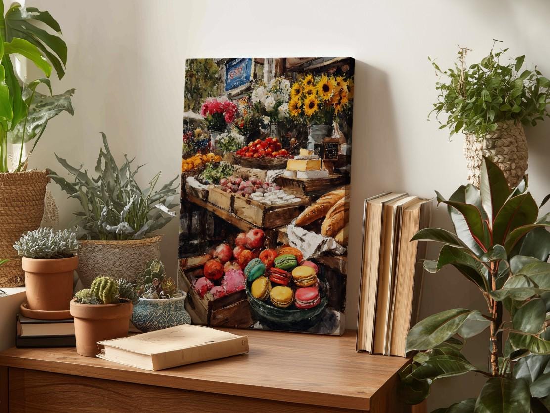 a wooden table with a painting of a fruit and vegetable market displayed on it. The table also has several potted plants, books, and other decorative items.