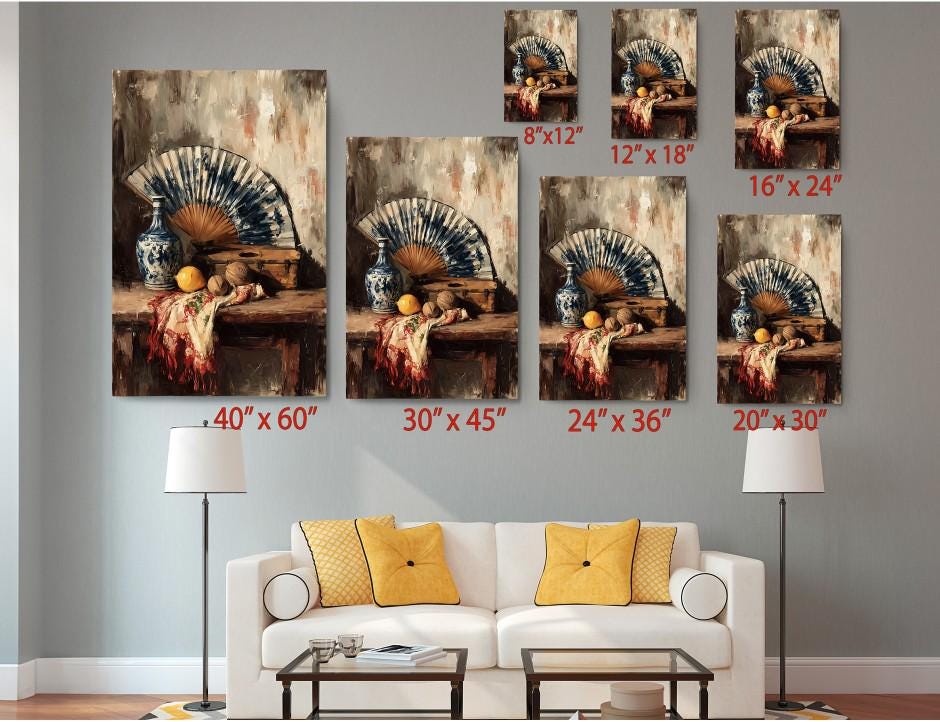 a living room with a white sofa and a coffee table. Above the sofa, there are six framed paintings of various sizes, each depicting a different scene with a vase, fan, and fruit. The paintings are arranged in a grid-like pattern on the wall, with each painting having a corresponding size indicated in the image.