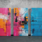 three paintings of different colors on a wall