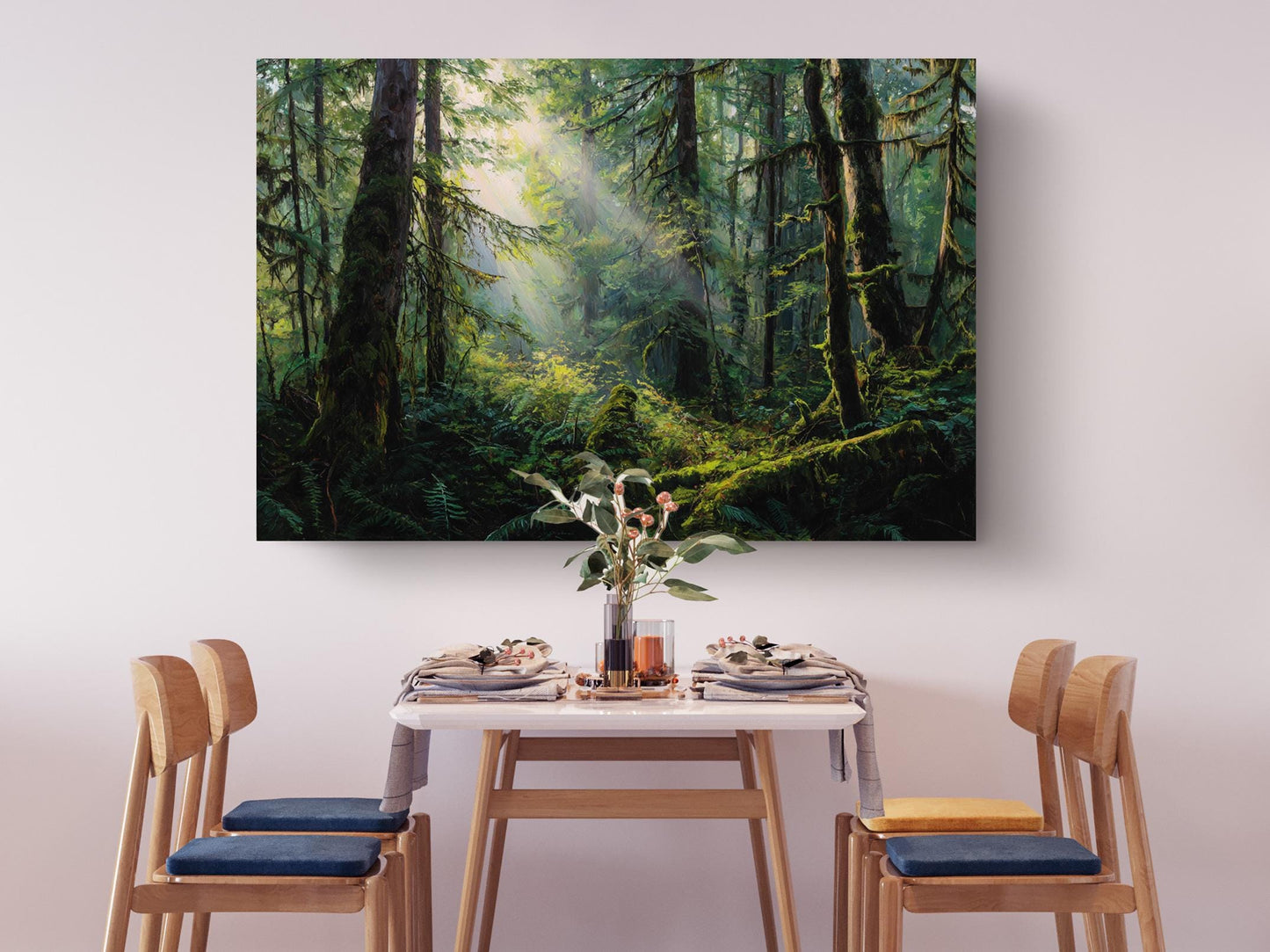 a serene dining scene with a table set for four, surrounded by four wooden chairs. Above the table, a large painting of a lush forest scene is displayed, creating a peaceful and natural ambiance.