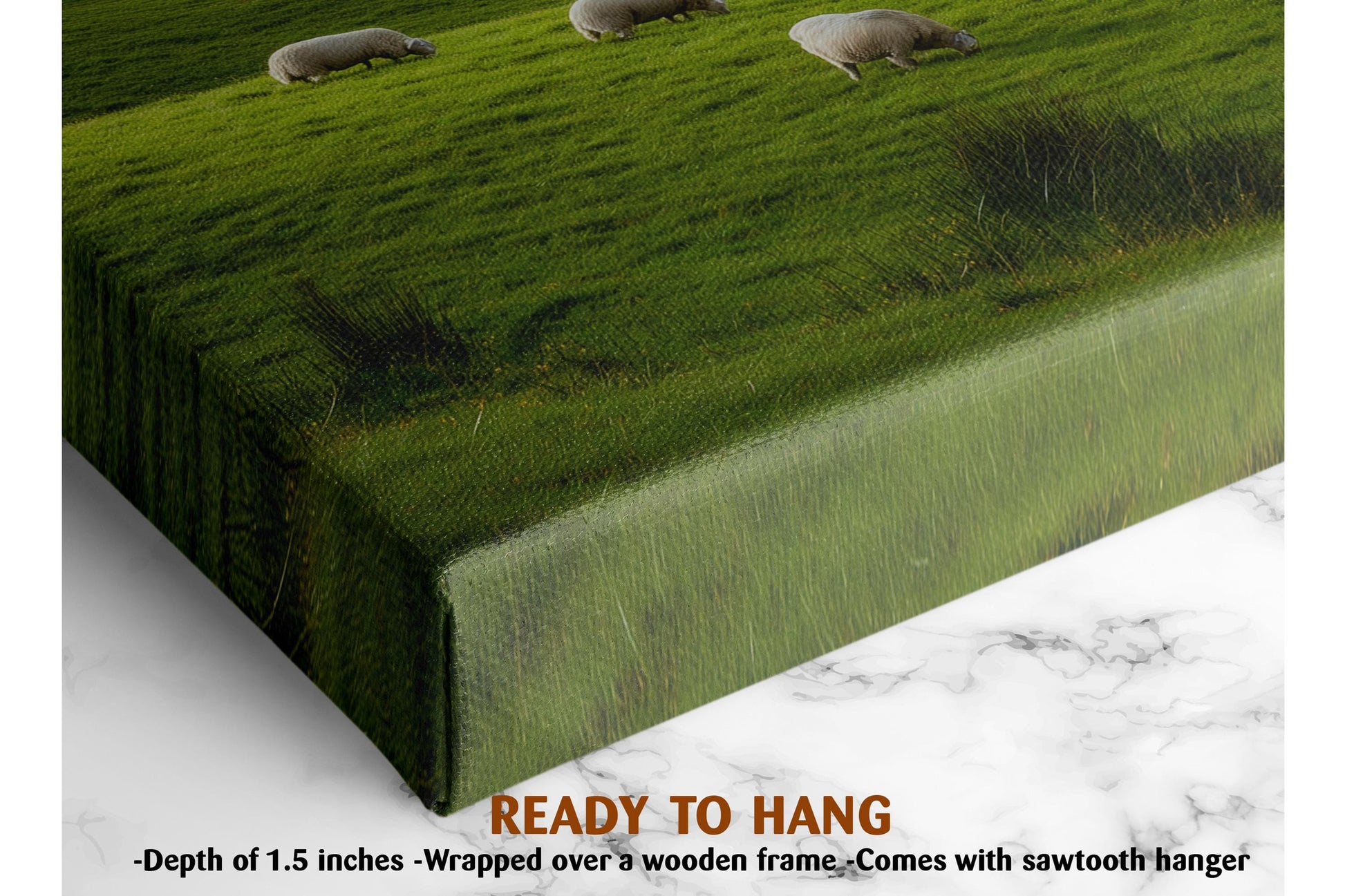 a pastoral scene with three sheep grazing on a lush green field. The sheep are spread out across the field, with one on the left side, one in the middle, and one on the right side. The image is framed by a wooden frame, and it is described as a ready-to-hang canvas print.