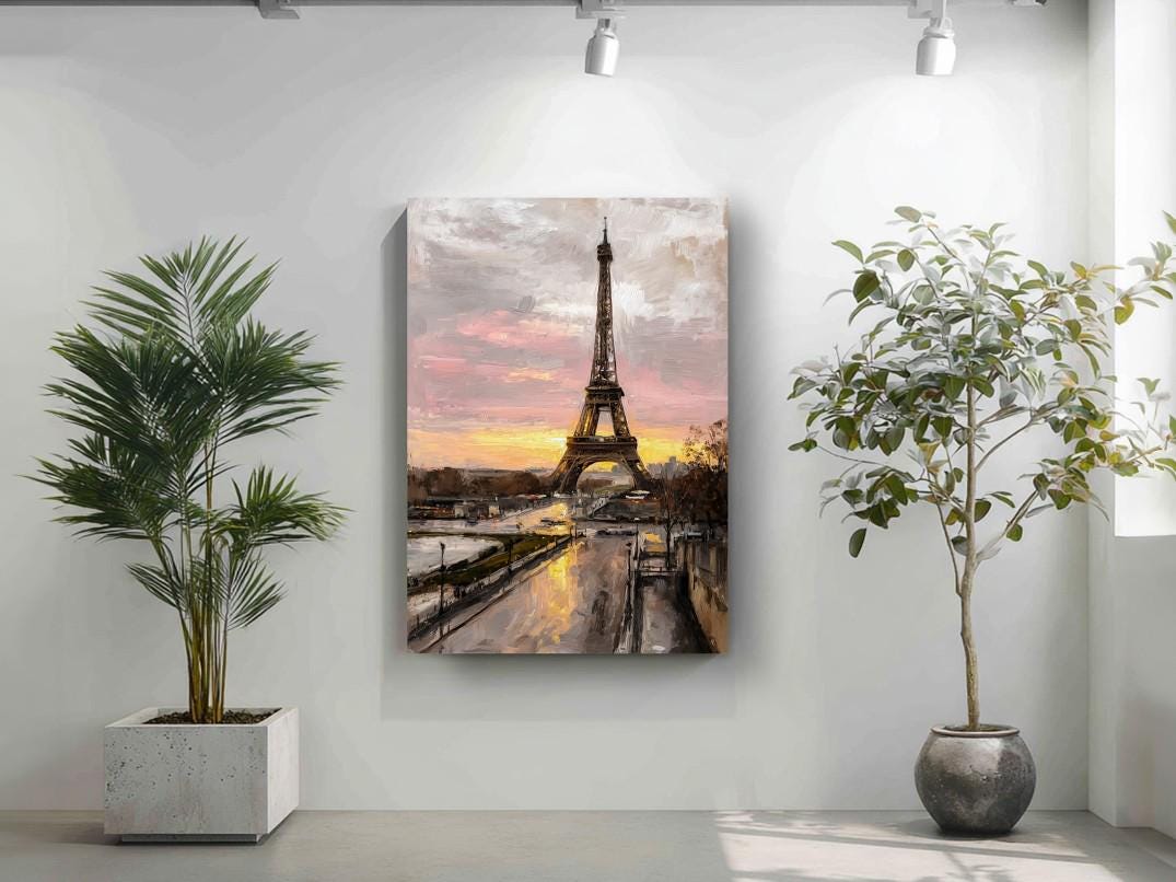 a large painting of the Eiffel Tower hanging on a wall, with a potted plant to the left and a plant to the right.