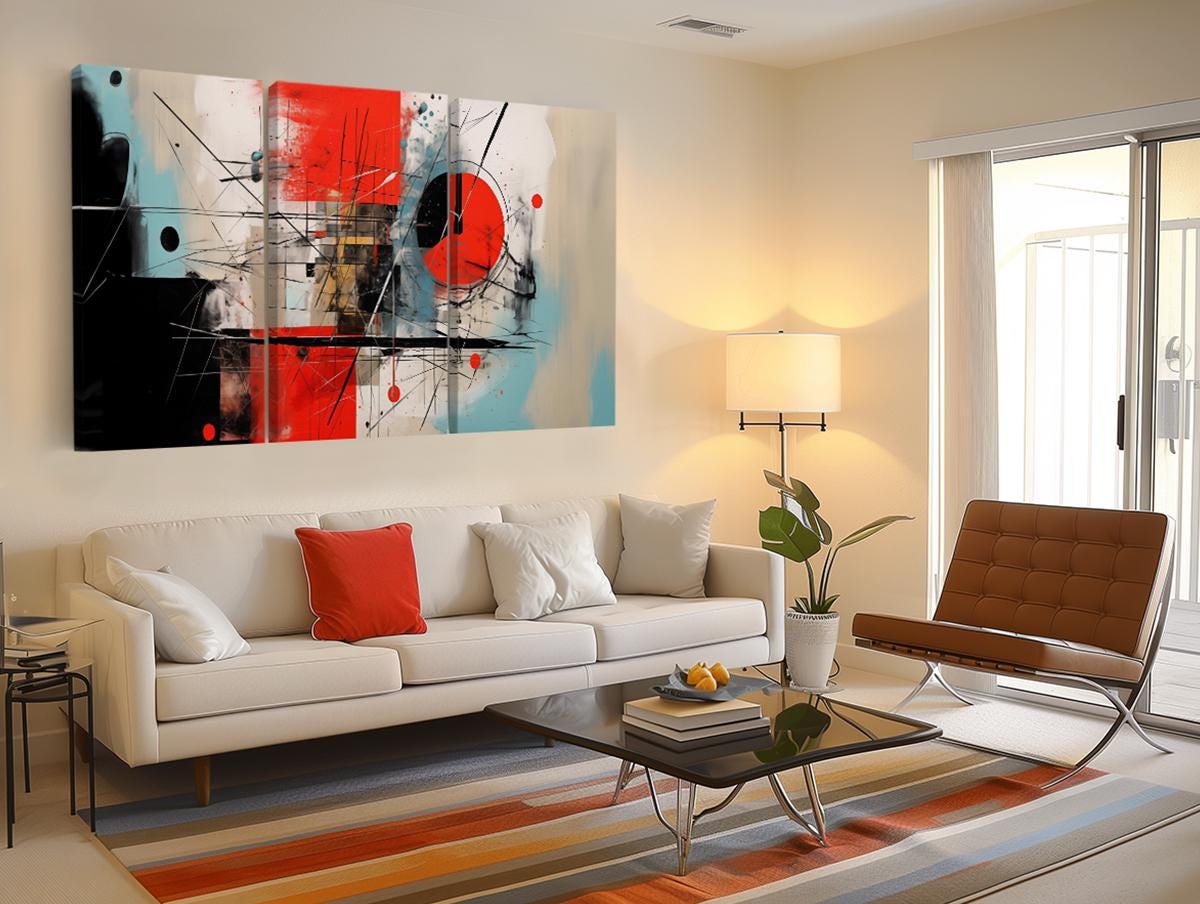 a living room filled with furniture and a painting on the wall