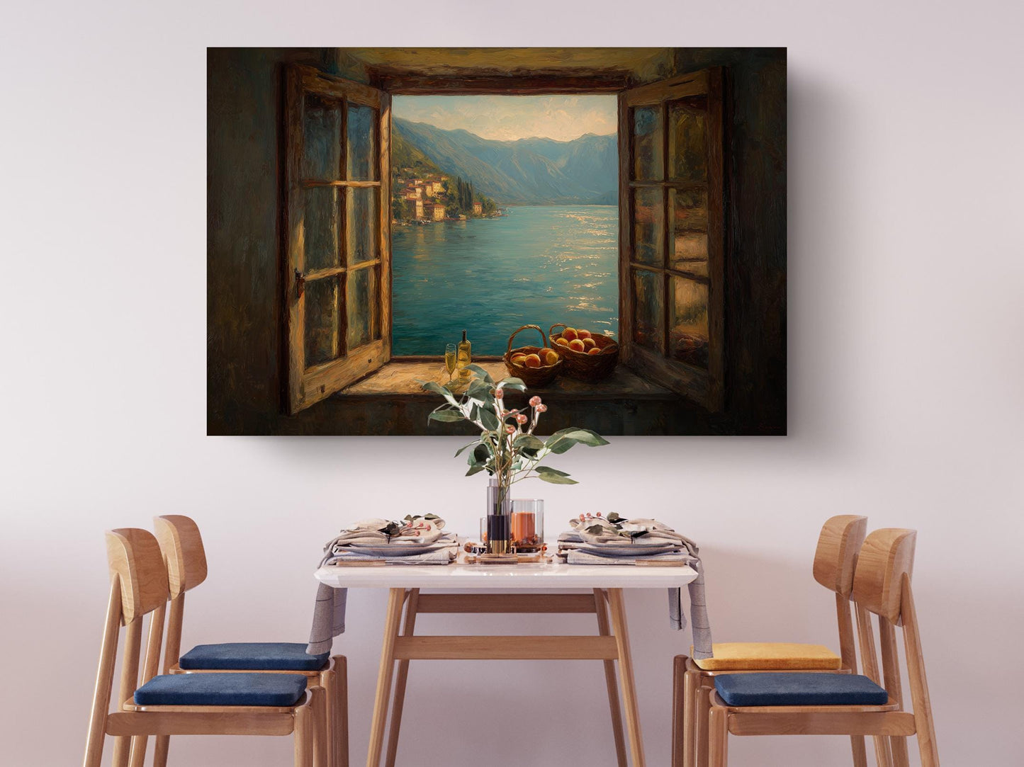 a dining table set with plates, silverware, and a vase of flowers, with a painting of a scenic view of a lake and mountains hanging above it.