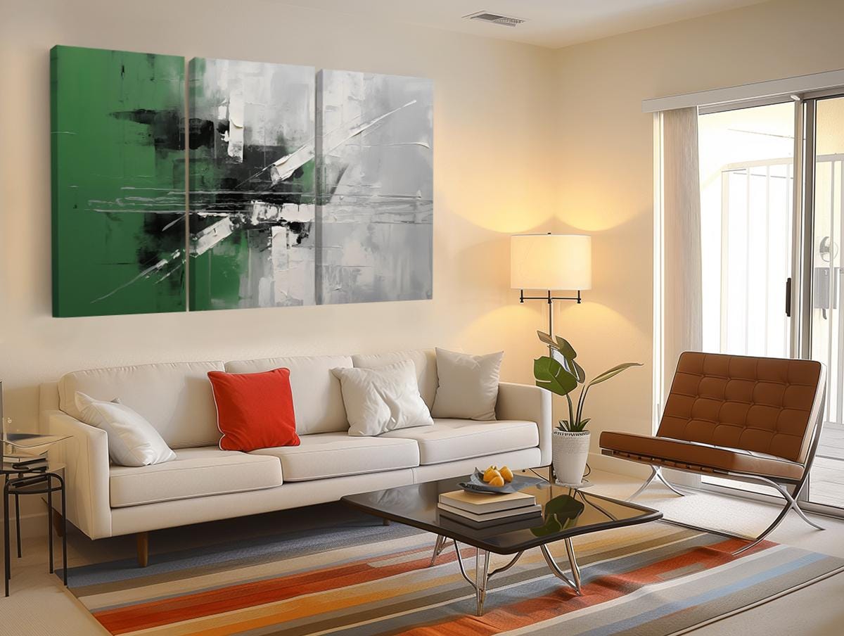 a living room filled with furniture and a painting on the wall
