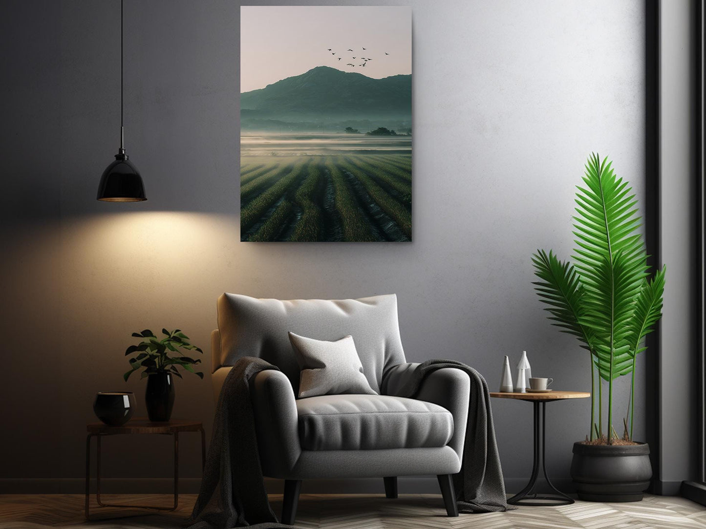 a modern living room with a gray armchair, a potted plant, and a framed landscape painting depicting a misty mountain landscape.