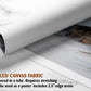 The image is a rolled canvas fabric, which is a type of canvas material used for painting or printing. It is described as a tube-delivered fabric, which means it is delivered in a tube and requires stretching before use. The fabric can be used as a poster with a 2.5&quot; edge area.