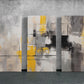 three abstract paintings on a wall in a room