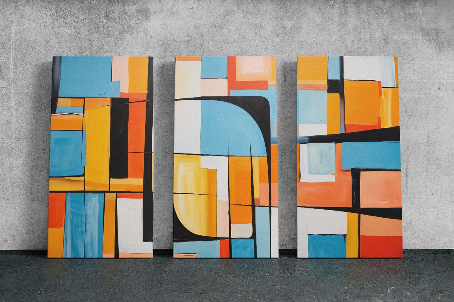 three paintings of different colors on a wall