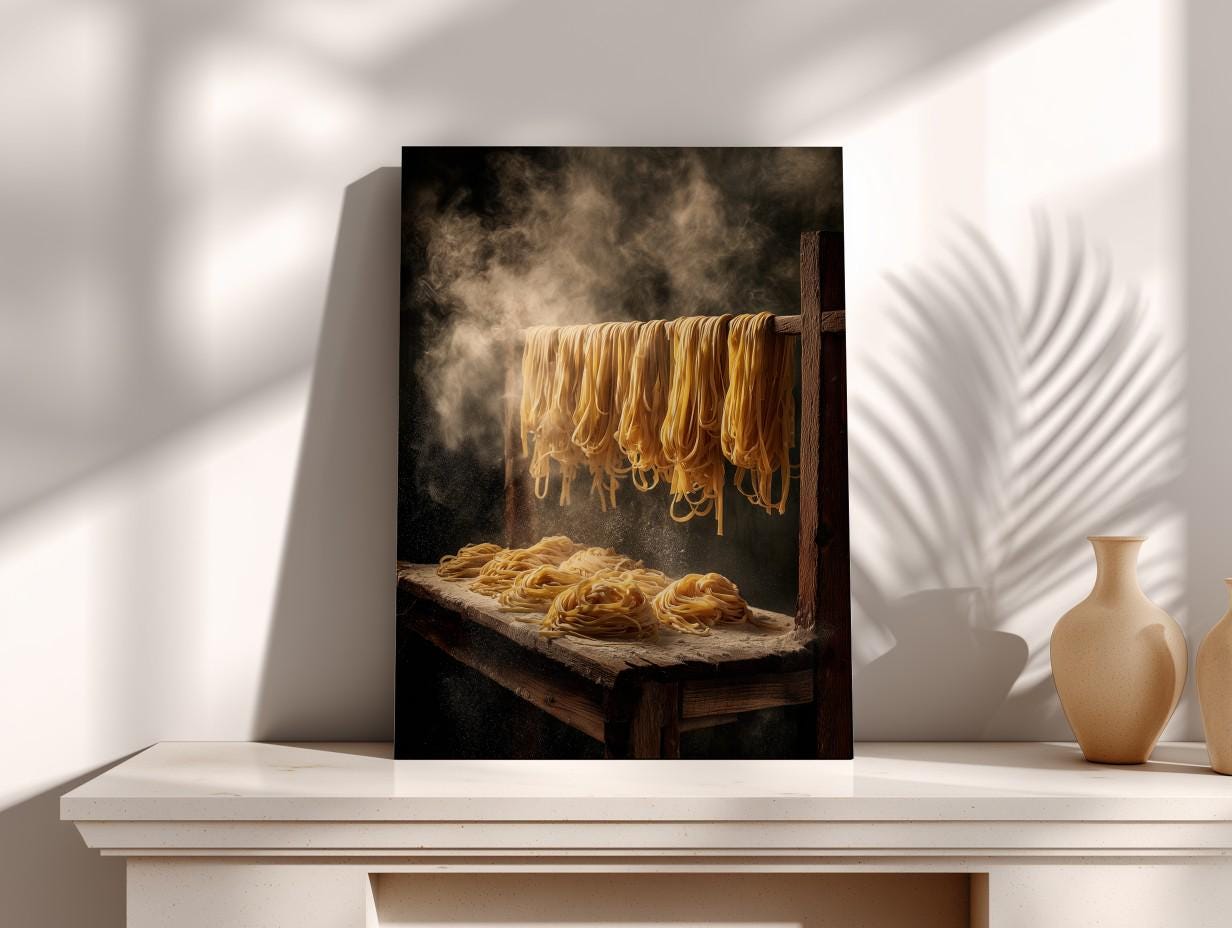 A framed photograph of uncooked spaghetti noodles drying on a wooden rack, with steam rising from the surface.