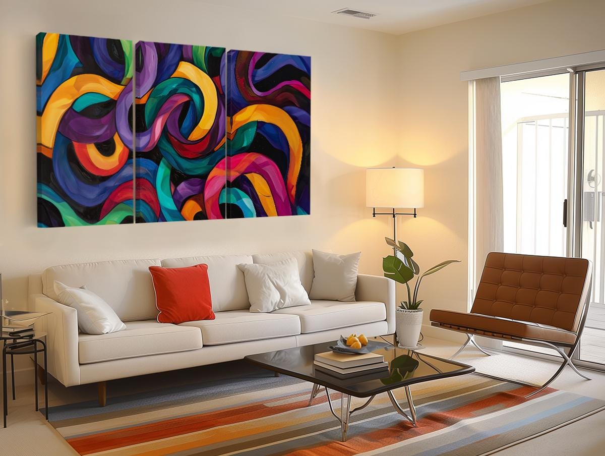 a living room filled with furniture and a painting on the wall