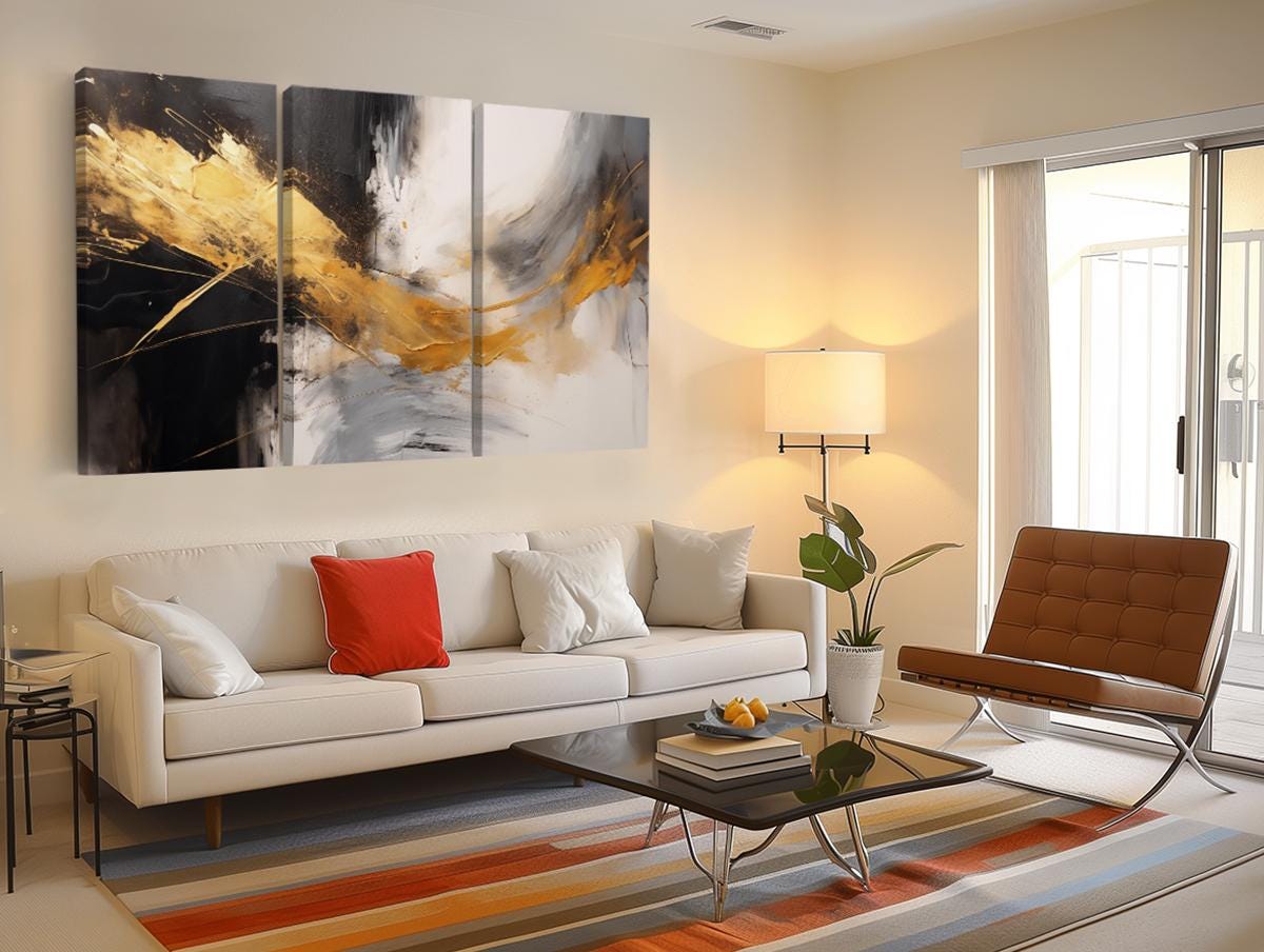 a living room filled with furniture and a painting on the wall