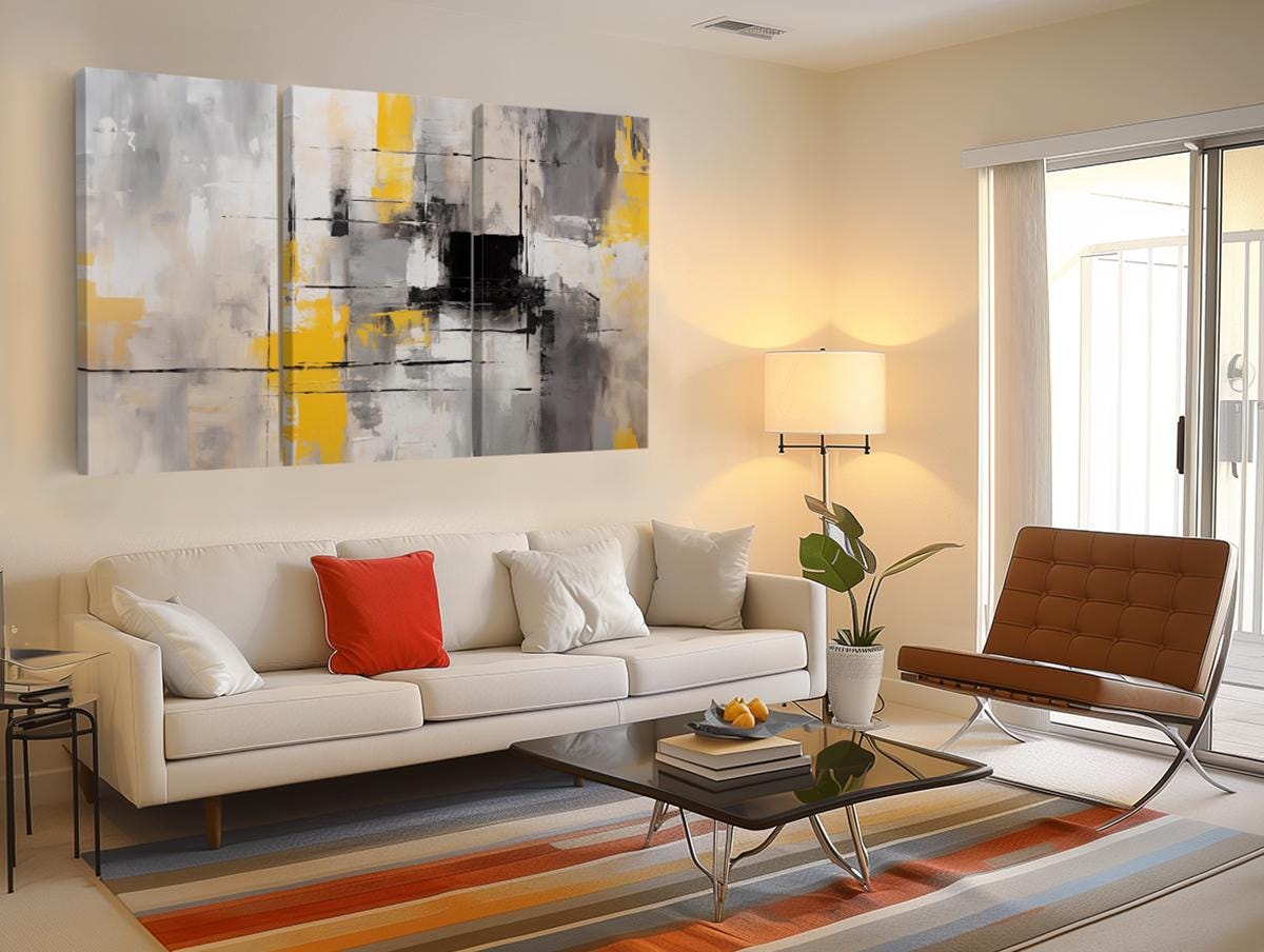a living room filled with furniture and a painting on the wall