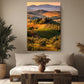 a large landscape painting hanging on a wall above a couch in a living room setting.