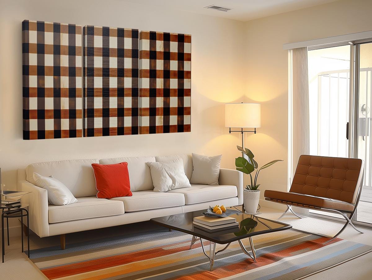 a living room filled with furniture and a painting on the wall