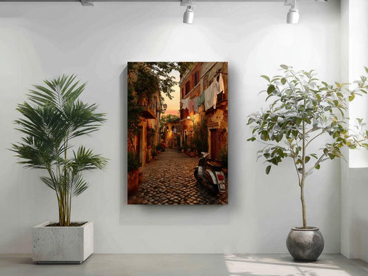 a narrow cobblestone street lined with buildings and trees, with a motorcycle parked on the side.