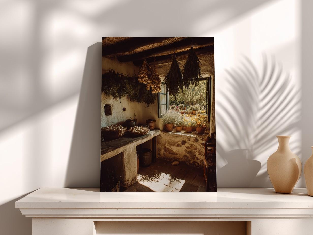 a rustic kitchen with a stone counter, hanging baskets of herbs, and a window overlooking a garden.