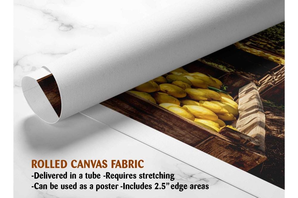 A rolled canvas fabric with a printed image of a wooden crate filled with yellow lemons.