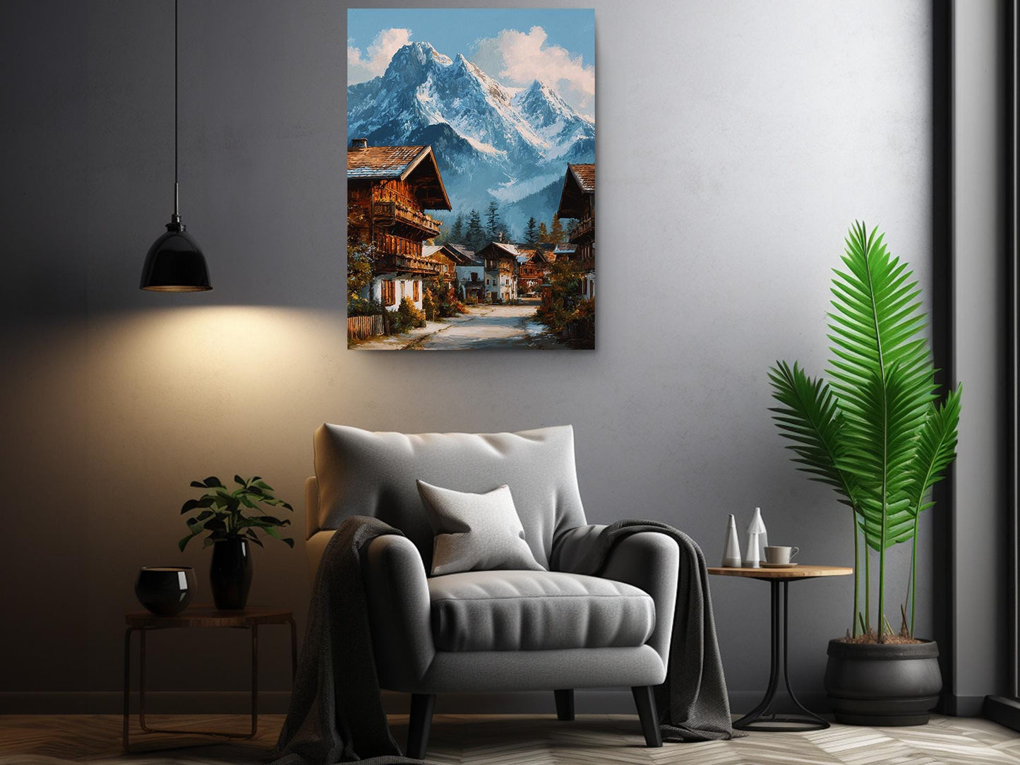 a cozy living room with a comfortable gray armchair, a wooden side table, and a potted plant. Above the armchair, there is a large painting of a picturesque mountain village with colorful houses and a winding road.