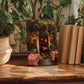 a wooden table with a framed photograph of a restaurant entrance, surrounded by potted plants and books.