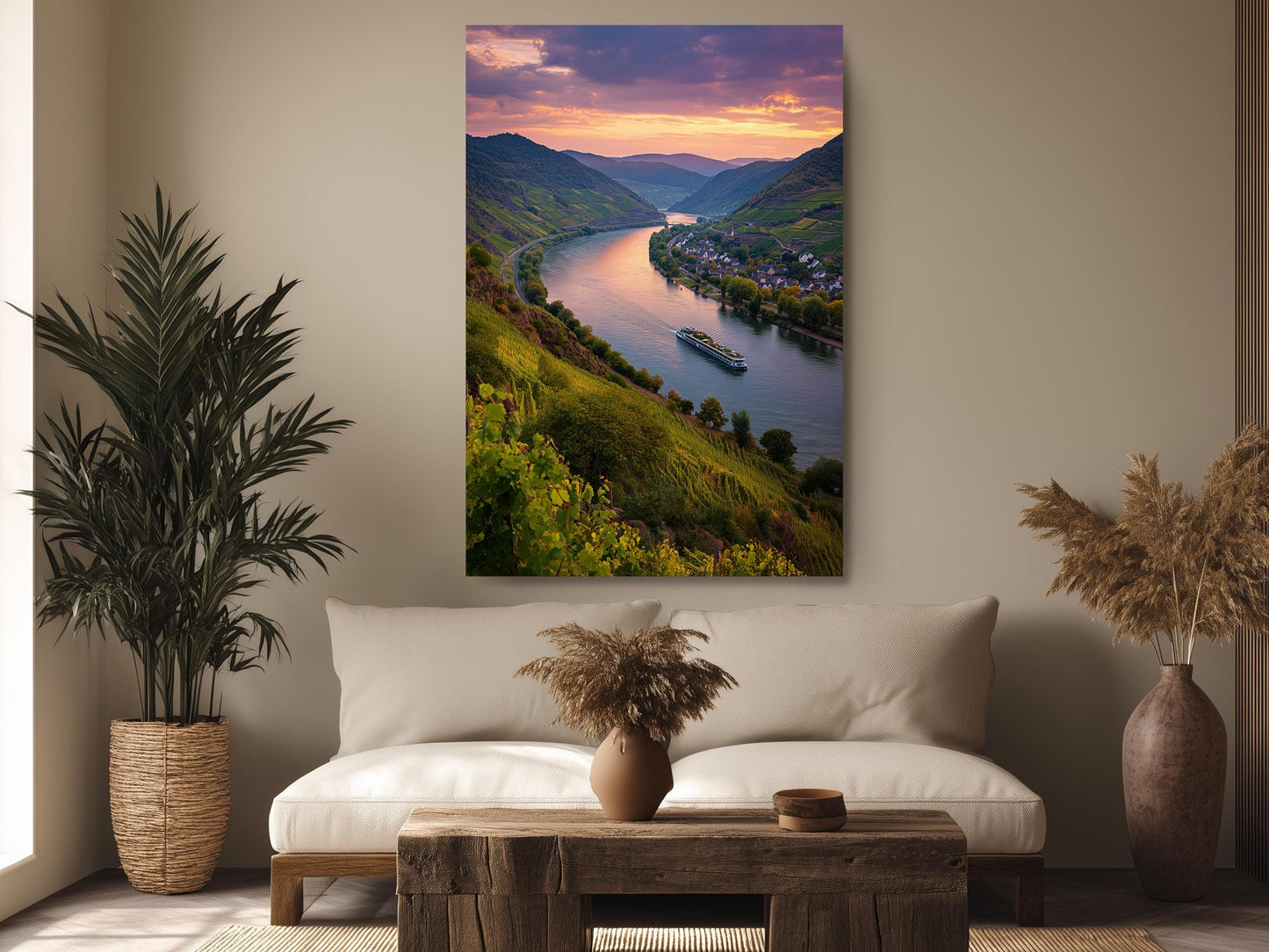 a serene living room with a large, vibrant painting of a river and mountains hanging on the wall. The painting captures a picturesque scene of a river winding through a lush, green valley, with a boat gently floating on the water. The room is decorated with a comfortable couch, a coffee table, and two potted plants, creating a cozy and inviting atmosphere.