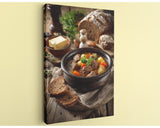 A hearty stew in a bowl, accompanied by a loaf of bread and a variety of vegetables, is the focal point of the image.