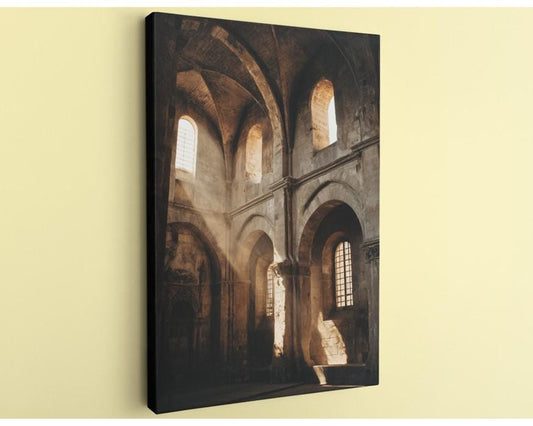 the interior of an old church, with arched windows and stone walls.